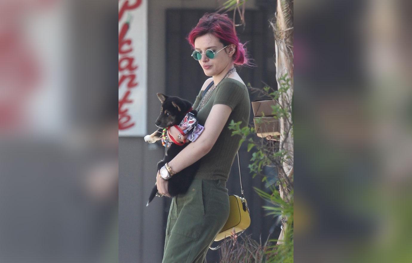 Bella Thorne looks thrilled while enjoying the day out with her new puppy