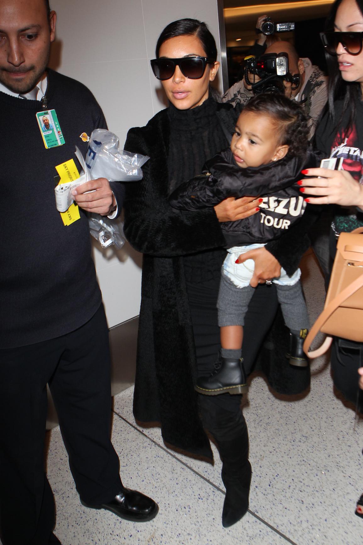 INF &#8211; Kim Kardashian dresses North West in a Yeezus jacket at LAX