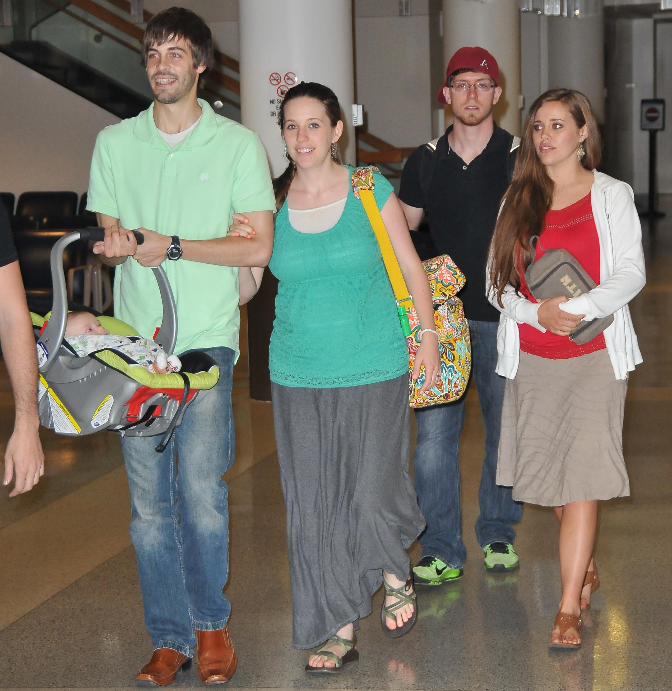 EXCLUSIVE: Jill and Jessa Duggar spotted Akron Airport with their husbands