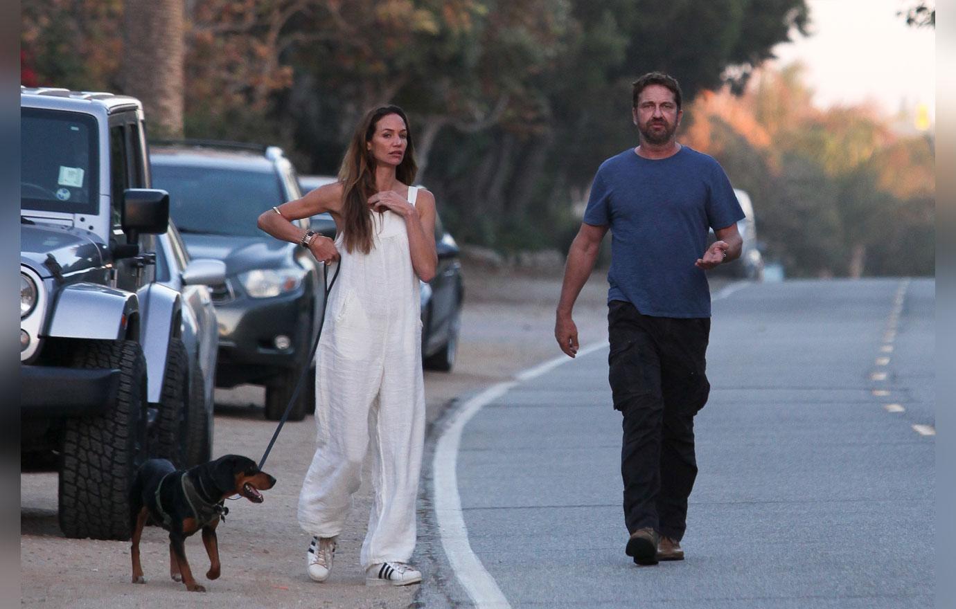 EXCLUSIVE: Gerard Butler and girlfriend Morgan Brown take a romantic stroll on the beach in Malibu, CA