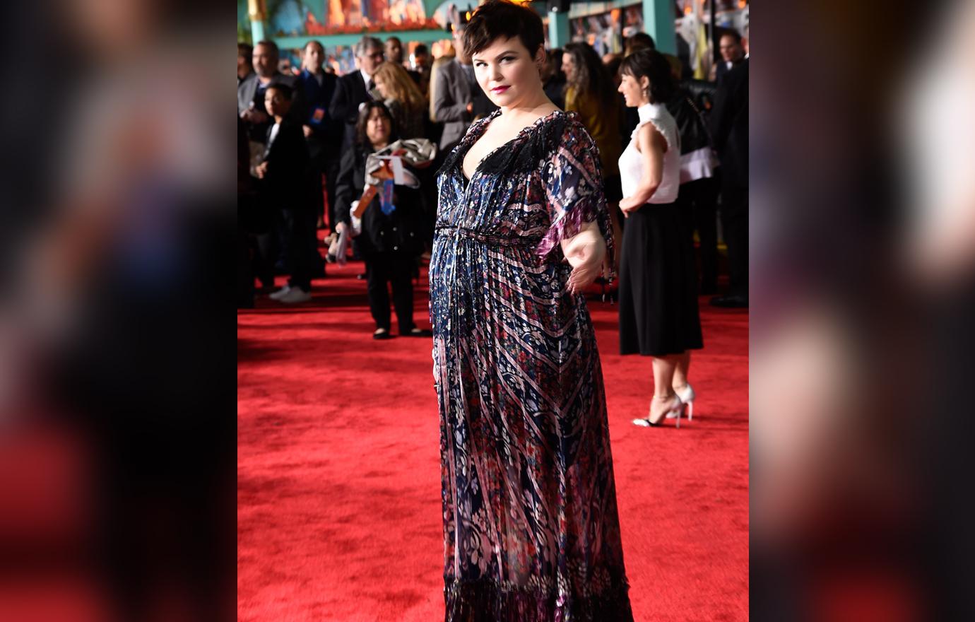 A pregnant Ginnifer Goodwin wears a colorful dress on the red carpet.