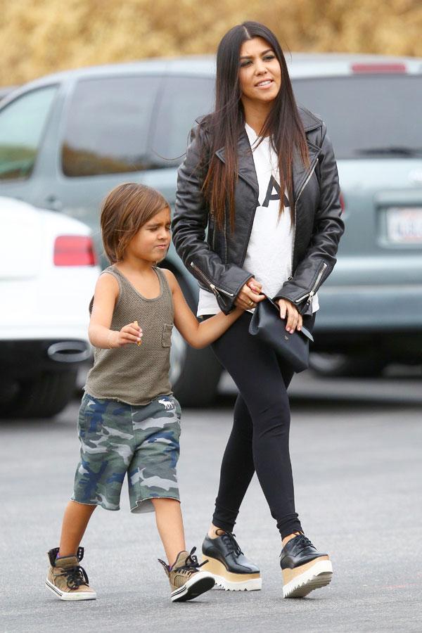 Kourtney Kardashian and little Mason get to work