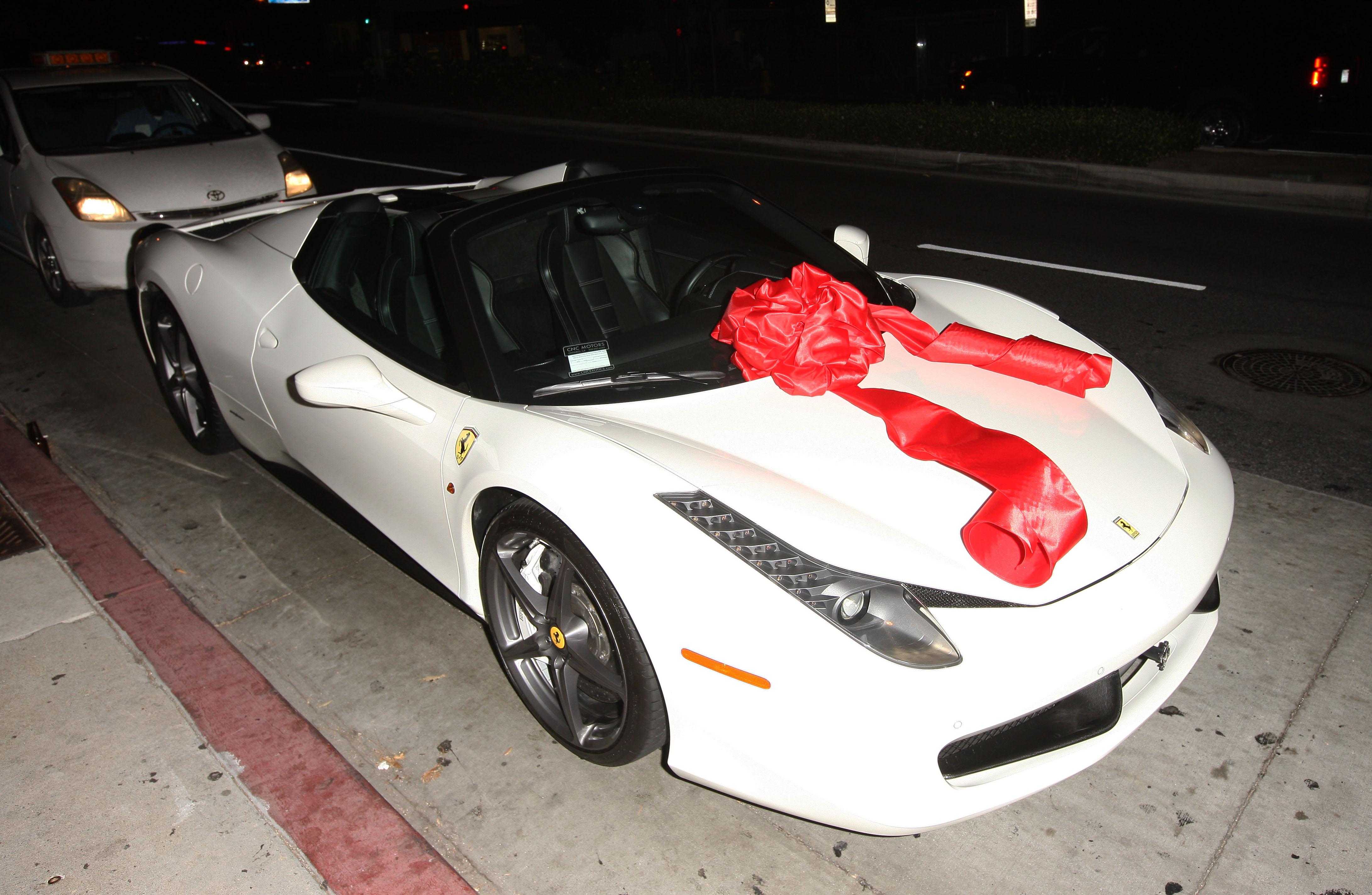 Tyga Surprises Kylie Jenner with a brand new Ferrari for her 18th Birthday at Bootsy Bellows