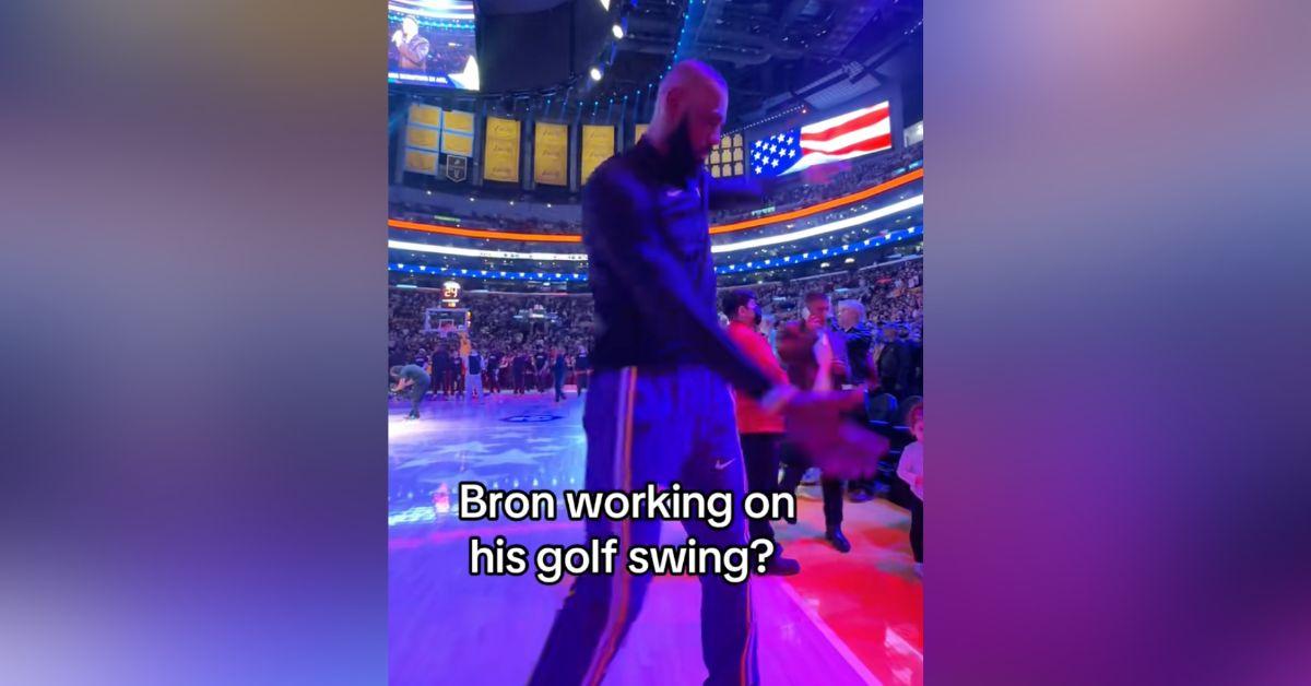 Image of LeBron James appeared to be working on his golf swing during the national anthem.