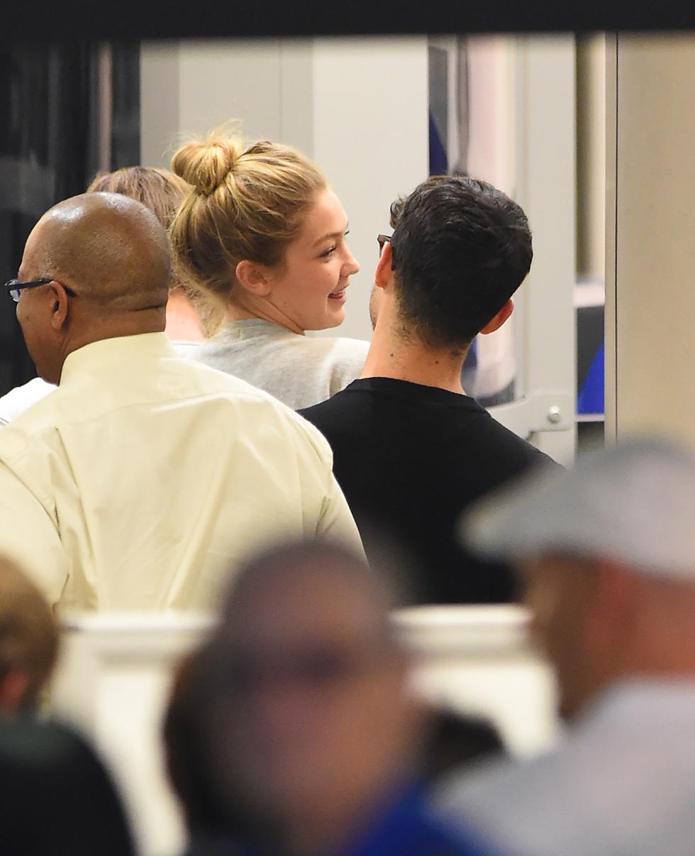 *EXCLUSIVE* Gigi Hadid and Joe Jonas affectionate as they depart LAX **NO UK**