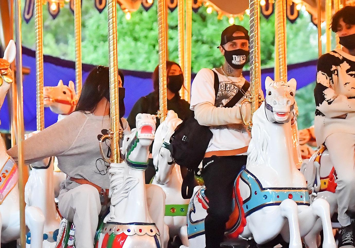 kourtney kardashian and travis barker take their modern family on a fun day out at disneyland