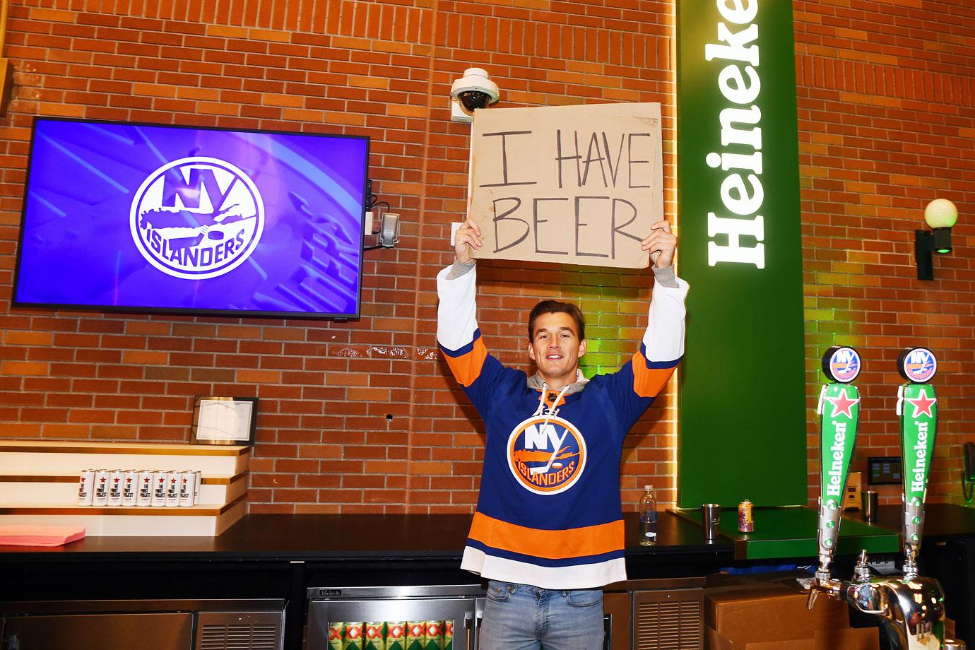 tyler cameron serving heineken at new york islanders game