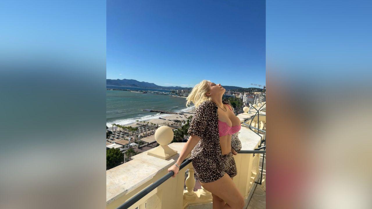 Image of Bebe Rexha tilted her head toward the sunshine as she took in the sweeping coastal views.