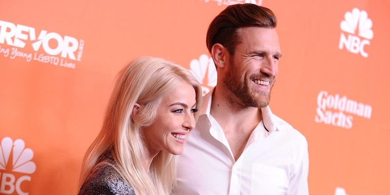 Julianne Hough and her husband smile brightly at The Trevor Project red carpet.