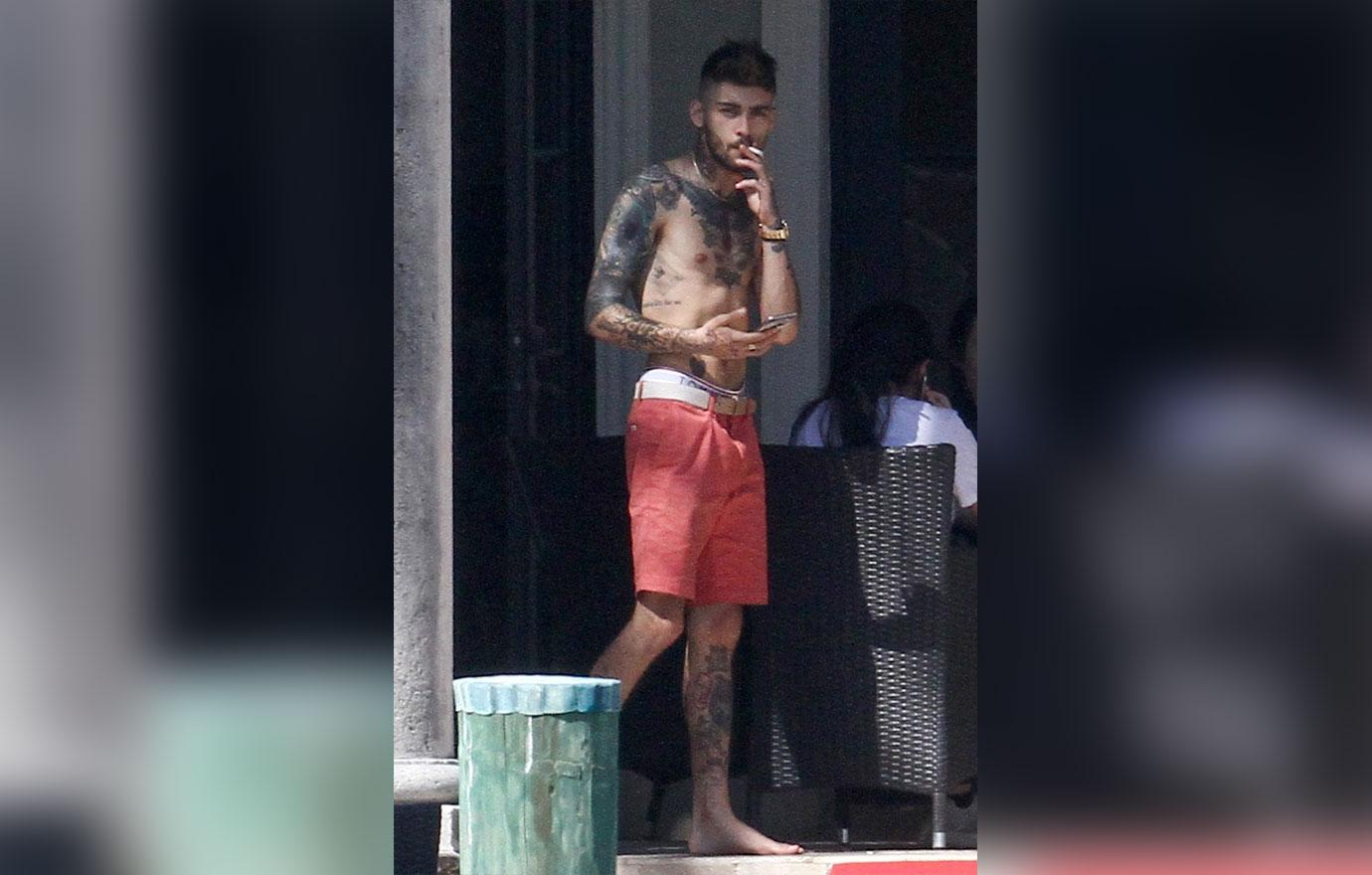 Zayn Malik looks extremely thin as he chain smokes by the pool after split from Gigi Hadid