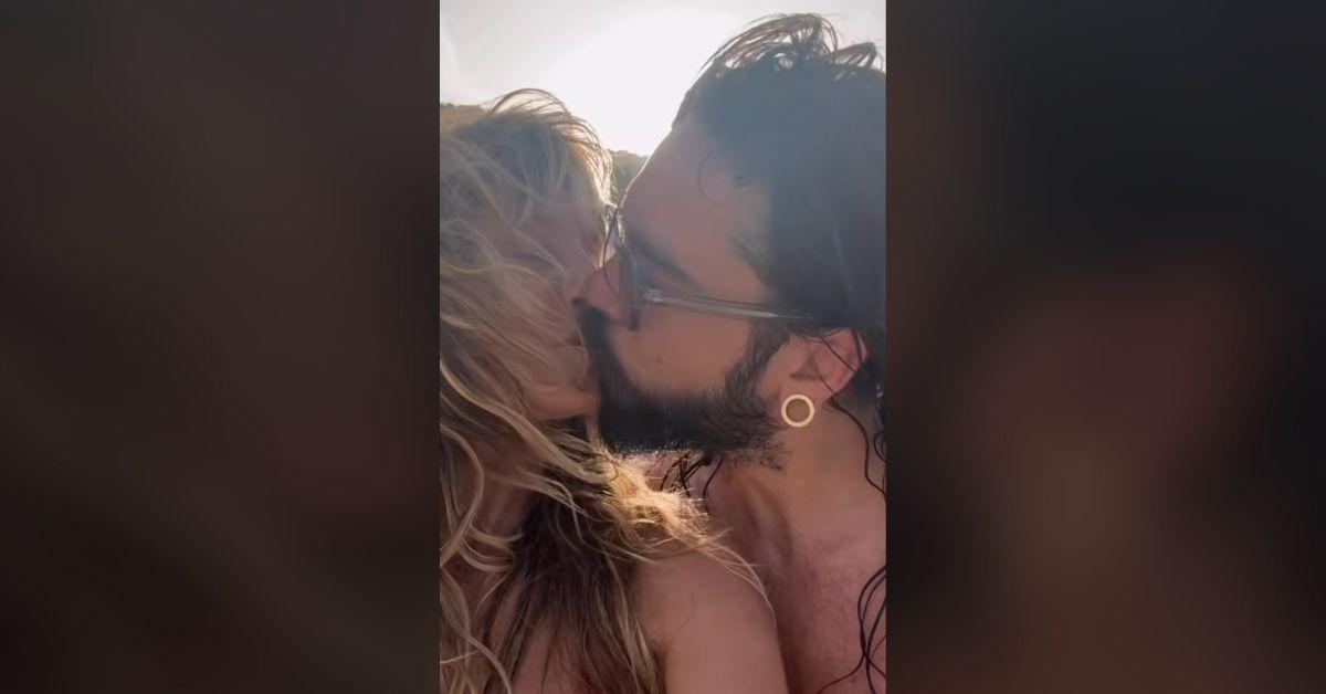 heidi klum bares cleavage racy video husband strokes body watch