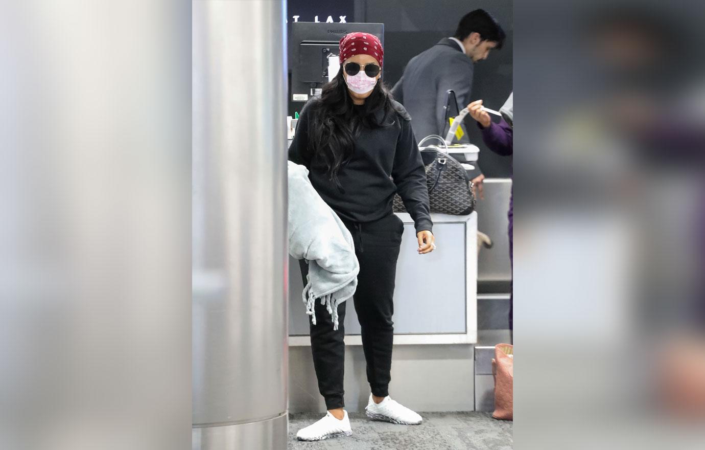 Angela Simmons Wears Face Mask At Airport Amid Coronavirus Outbreak