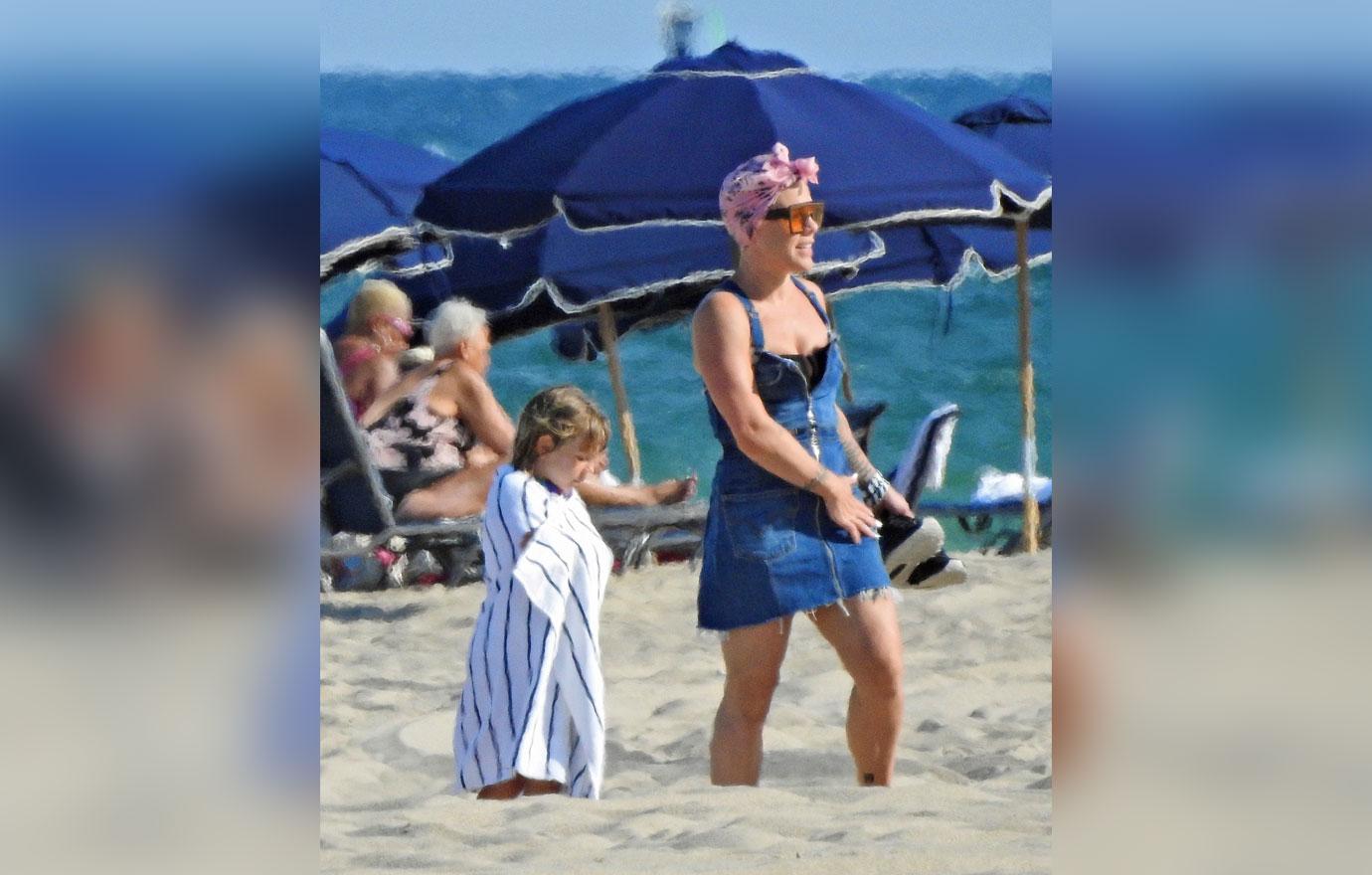 Pink and her adorable family ride some Jet Skis on the Beach in Florida