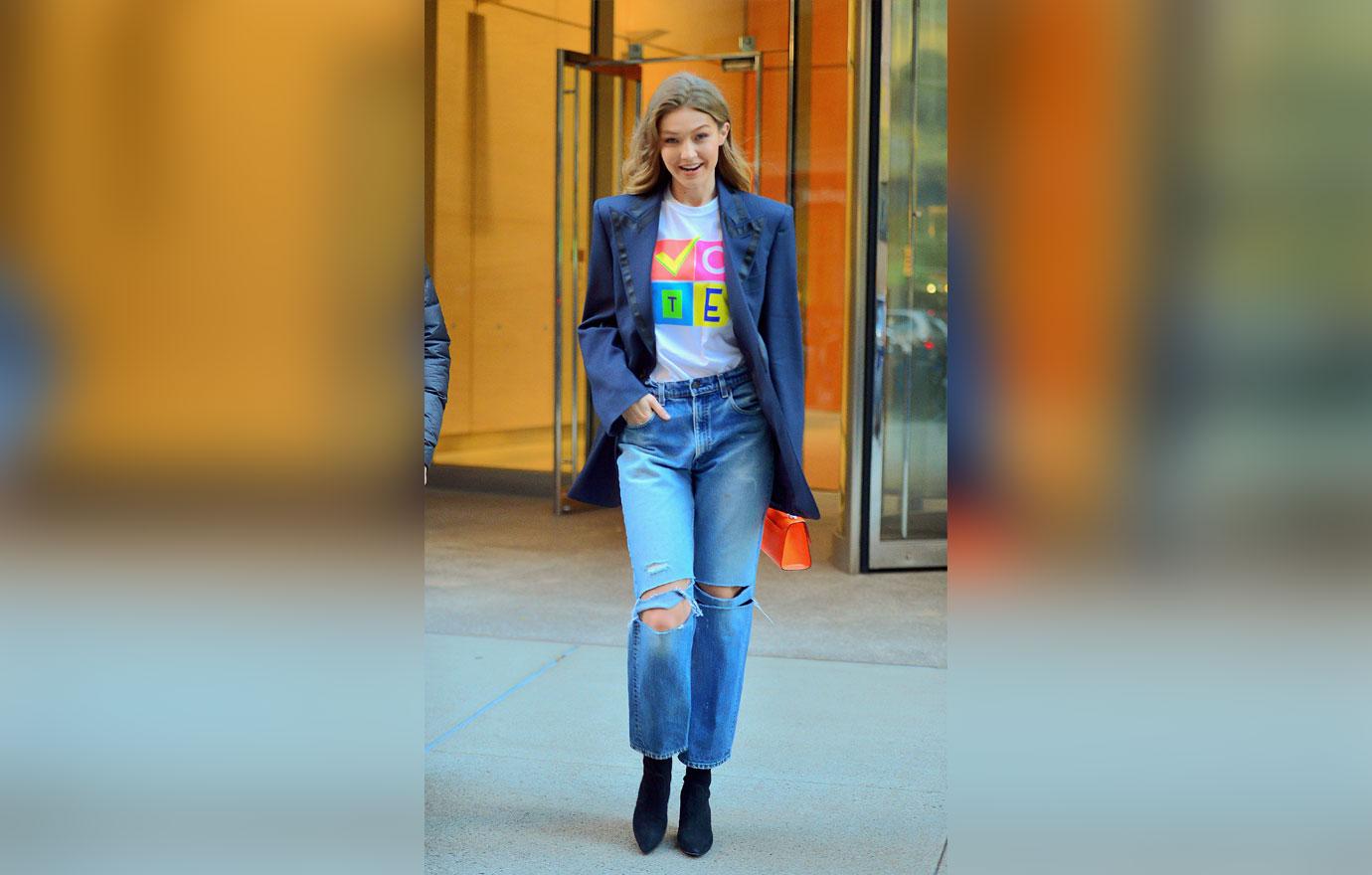 Gigi Hadid is all smiles showing off her VOTE t shirt as she leaves Victoria Secret fashion show fittings in NYC