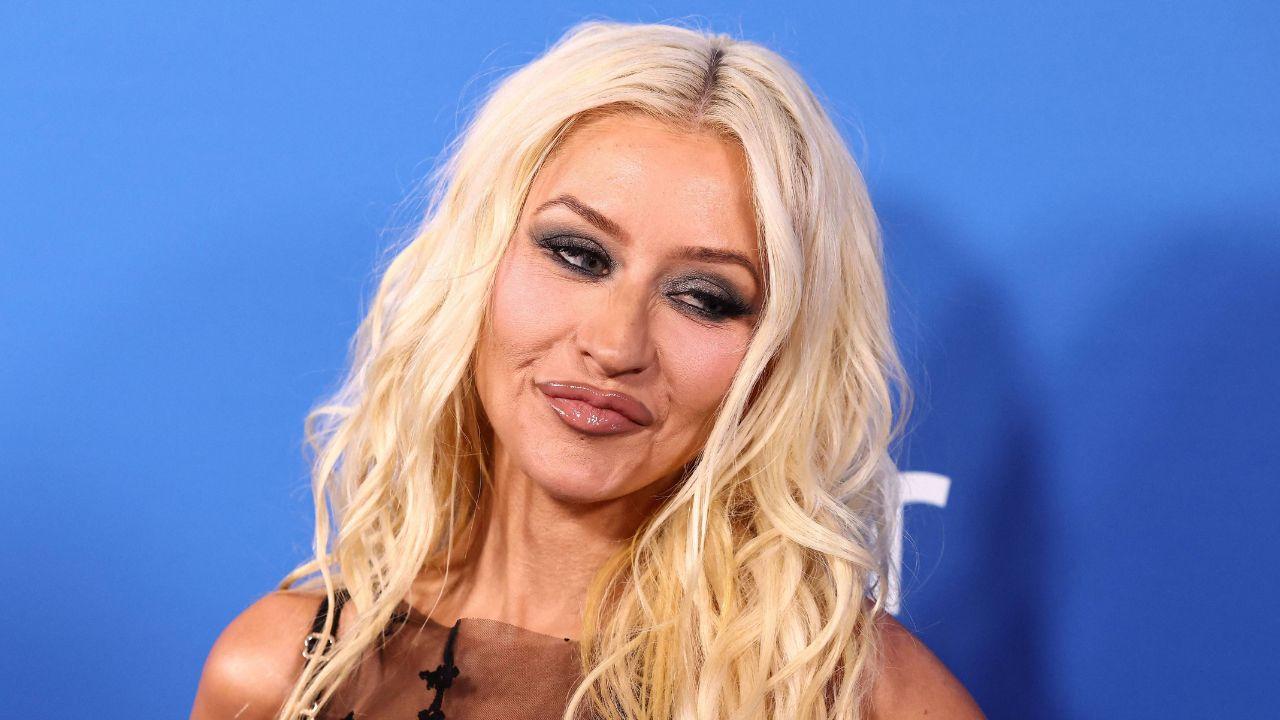 image of Christina Aguilera completed her gothic-inspired outfit with a black lace bra and high-waisted underwear.