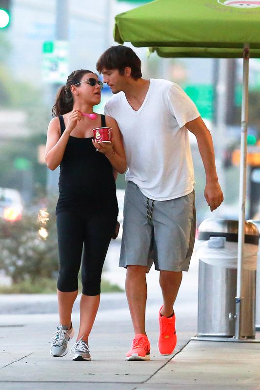 *EXCLUSIVE* Ashton and Mila feed her cravings with a Frozen Yogurt and a Kiss