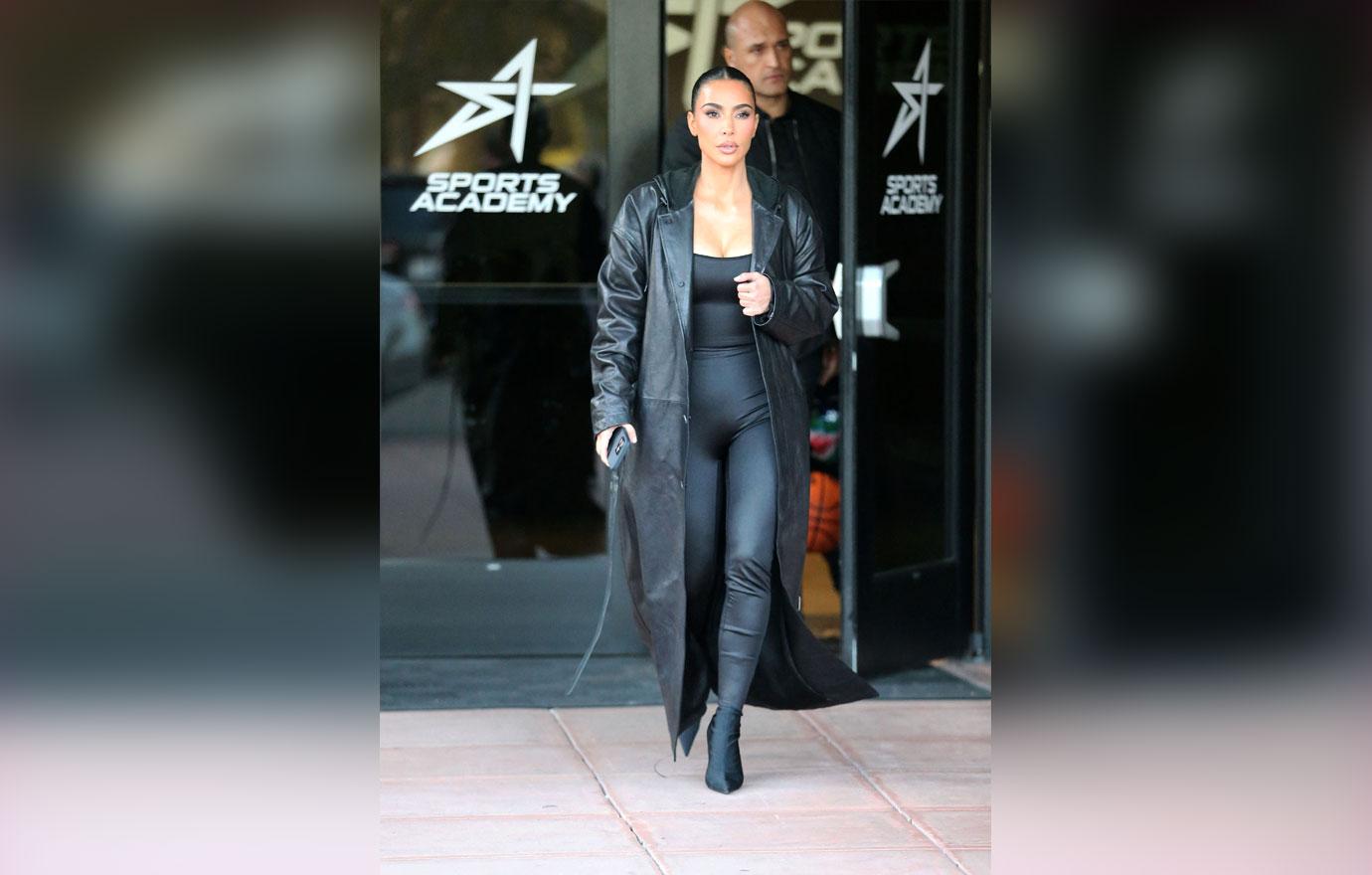 kim kardashian wears a long black leather jacket