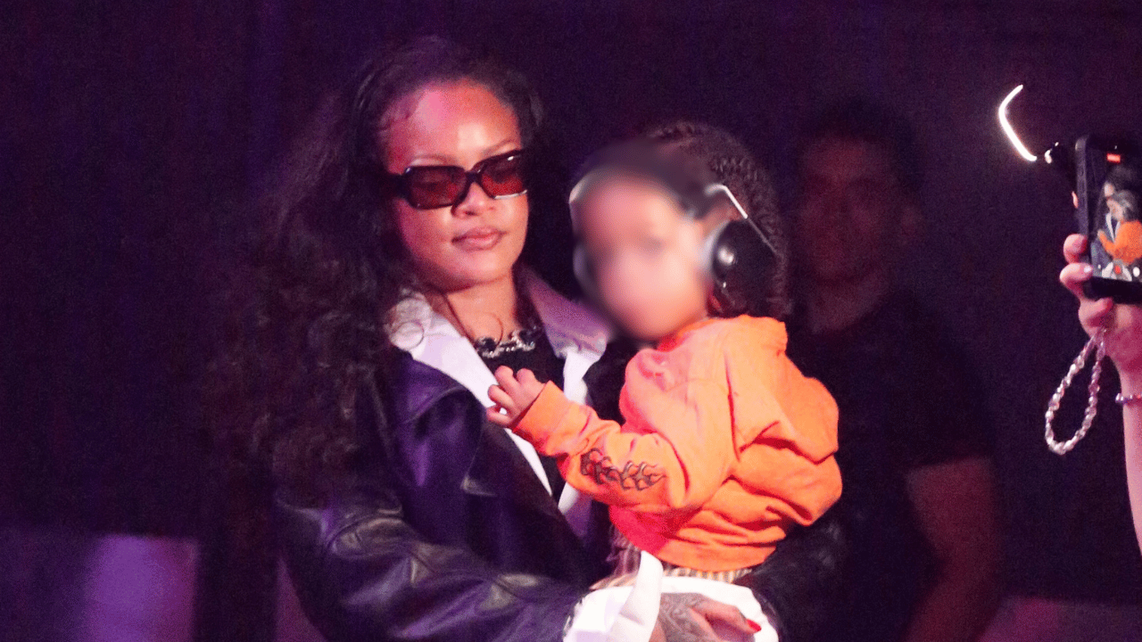 Image of Rihanna kept her son close as they watched A$AP Rocky take the stage.