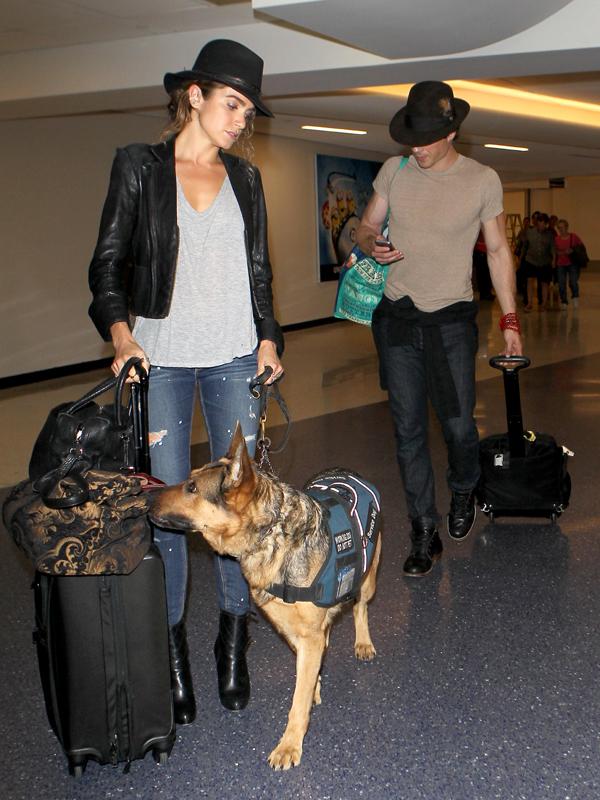 Nikki Reed and Ian Somerhalder wear matching hats as they arrive in Los Angeles with Reed&#039;s Service Dog