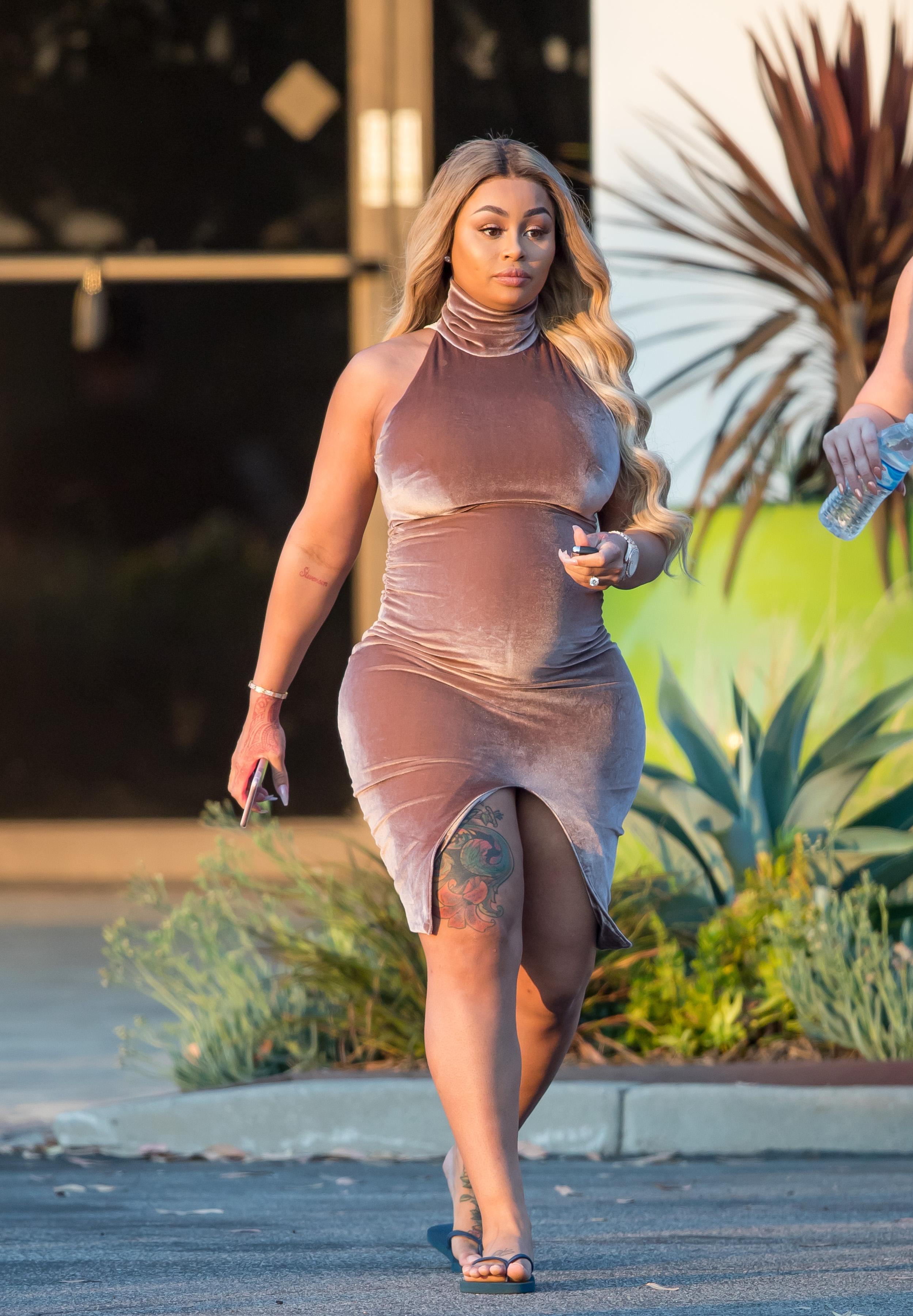 EXCLUSIVE: Pregnant Blac Chyna shows her curves in a  tight dress while out with friends in Los Angeles