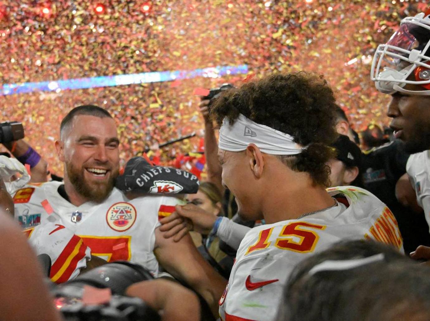 travis kelce brittany mahomes smile dinner parade shooting photo