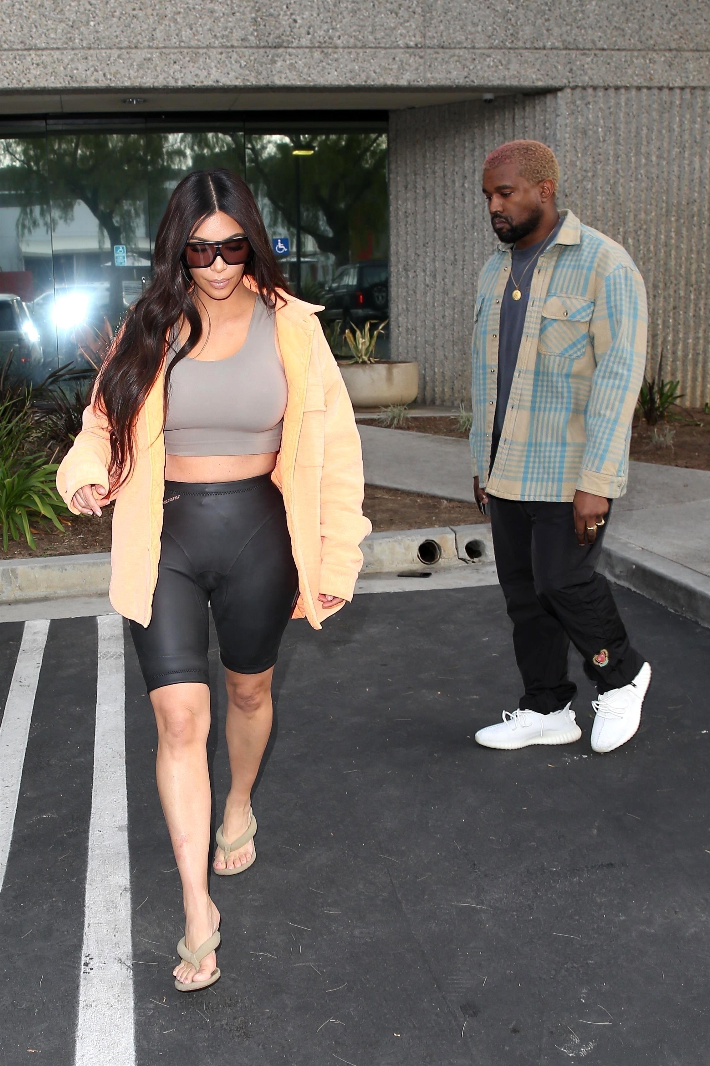 *EXCLUSIVE* Kim Kardashian wears biker shorts and bra top for mid day visit to Kanye at the Studio