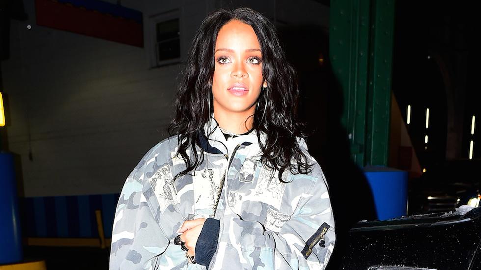 EXCLUSIVE: Rihanna gets a piggyback from her bodyguard to avoid stepping in a snow pile