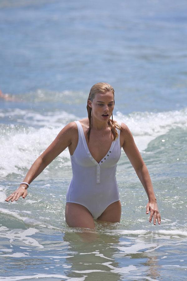 Margot Robbie slips her incredible bikini body into tight white