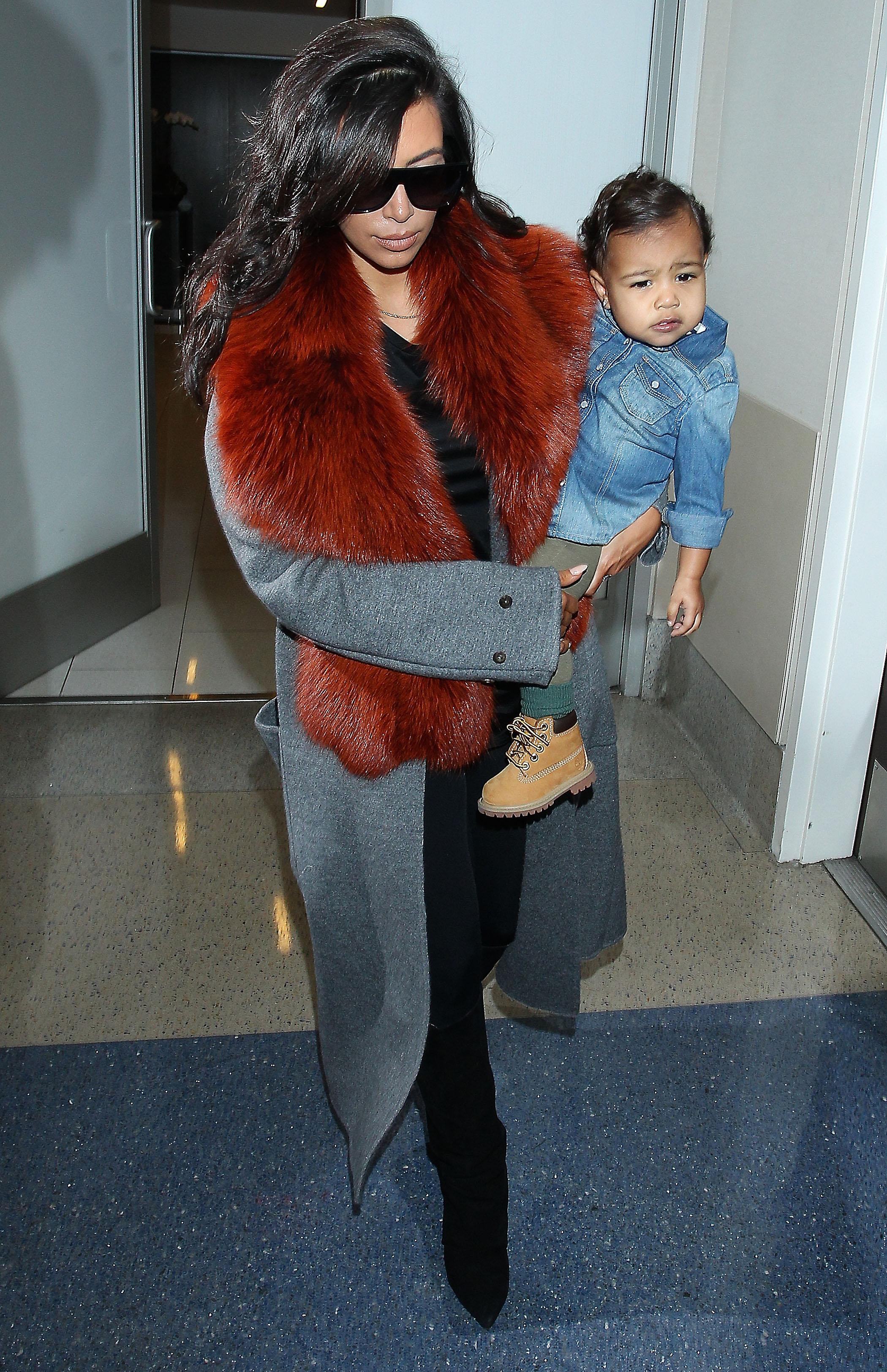 Kim Kardashian and  baby North West at the Los Angeles International Airport  ***NO DAILY MAIL SALES***