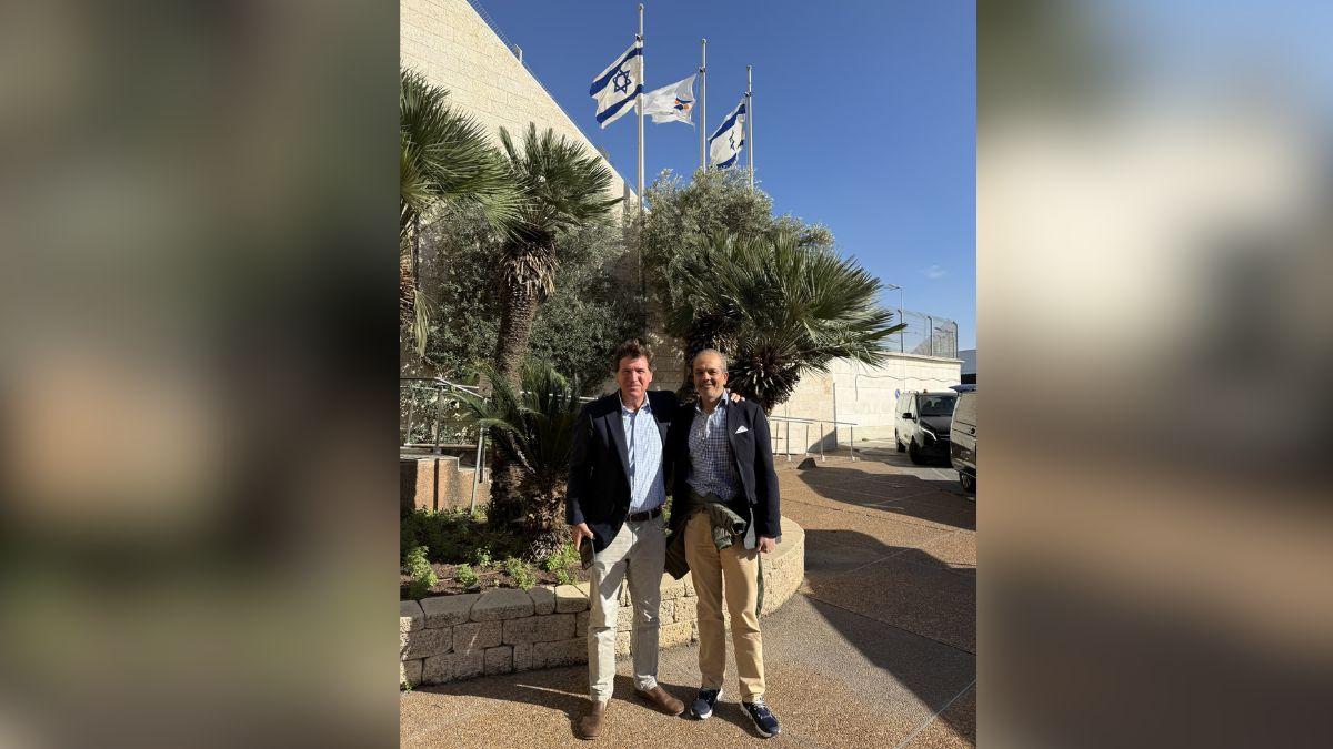 image of Tucker Carlson shared a photo of himself at the airport in Israel.