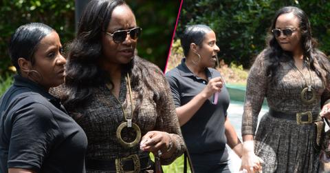 Pat houston tina brown hold hands outside hospice center