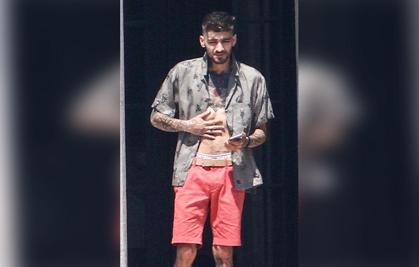 Zayn Malik looks extremely thin as he chain smokes by the pool after split from Gigi Hadid