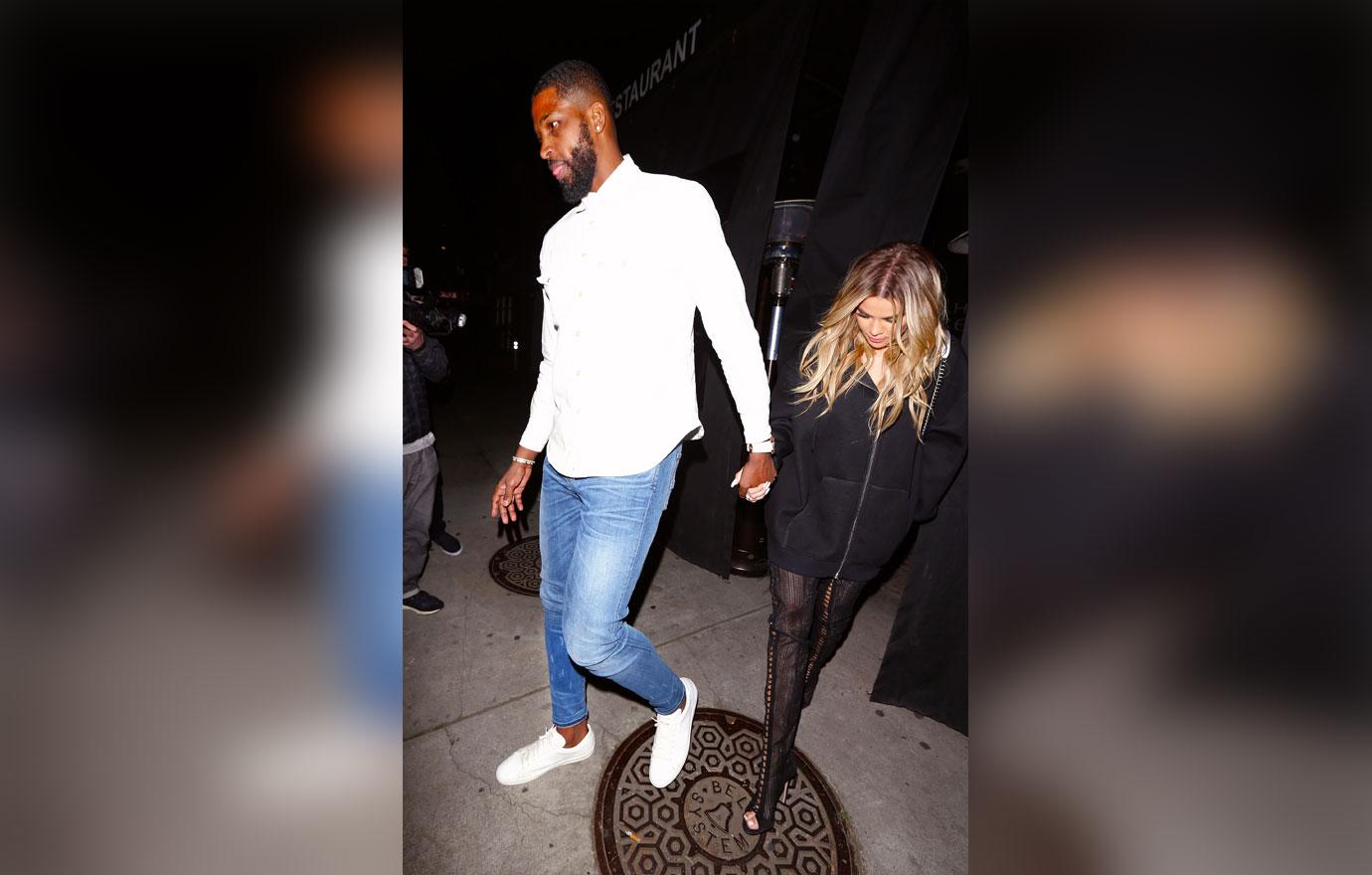 Khloe Kardashian and Tristan Thompson kiss during a dinner date in Beverly Hills