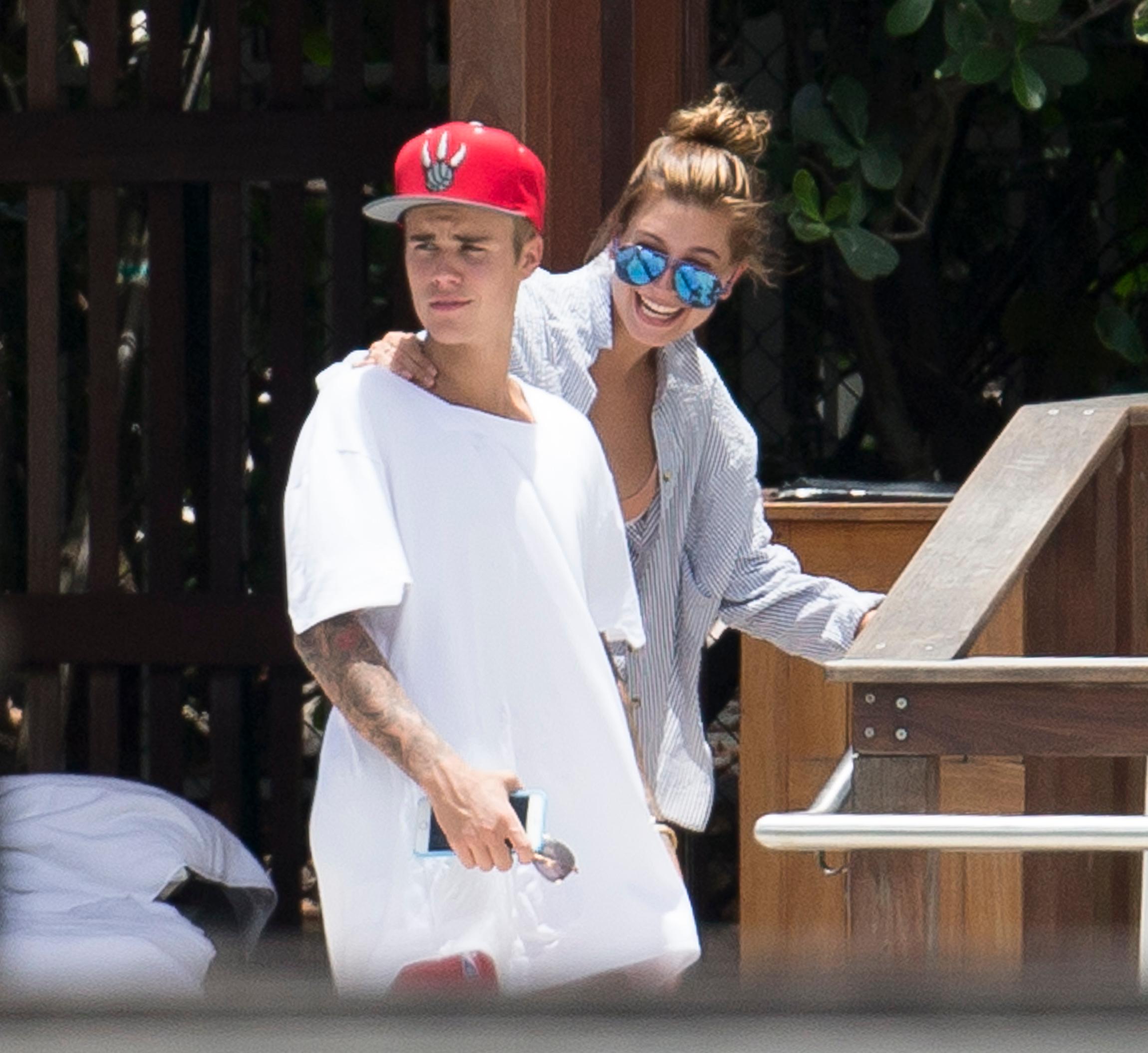 Justin Bieber and Hailey Baldwin hang out at the pool together in Miami.