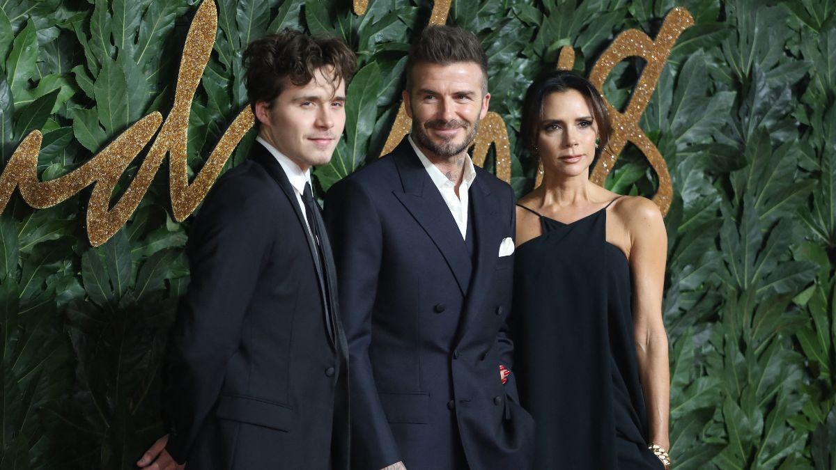 Photo of Brooklyn, David and Victoria Beckham.