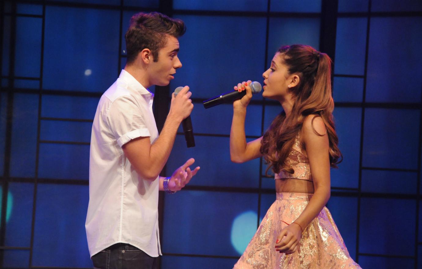 Ariana Grande & Nathan Skykes perform a song