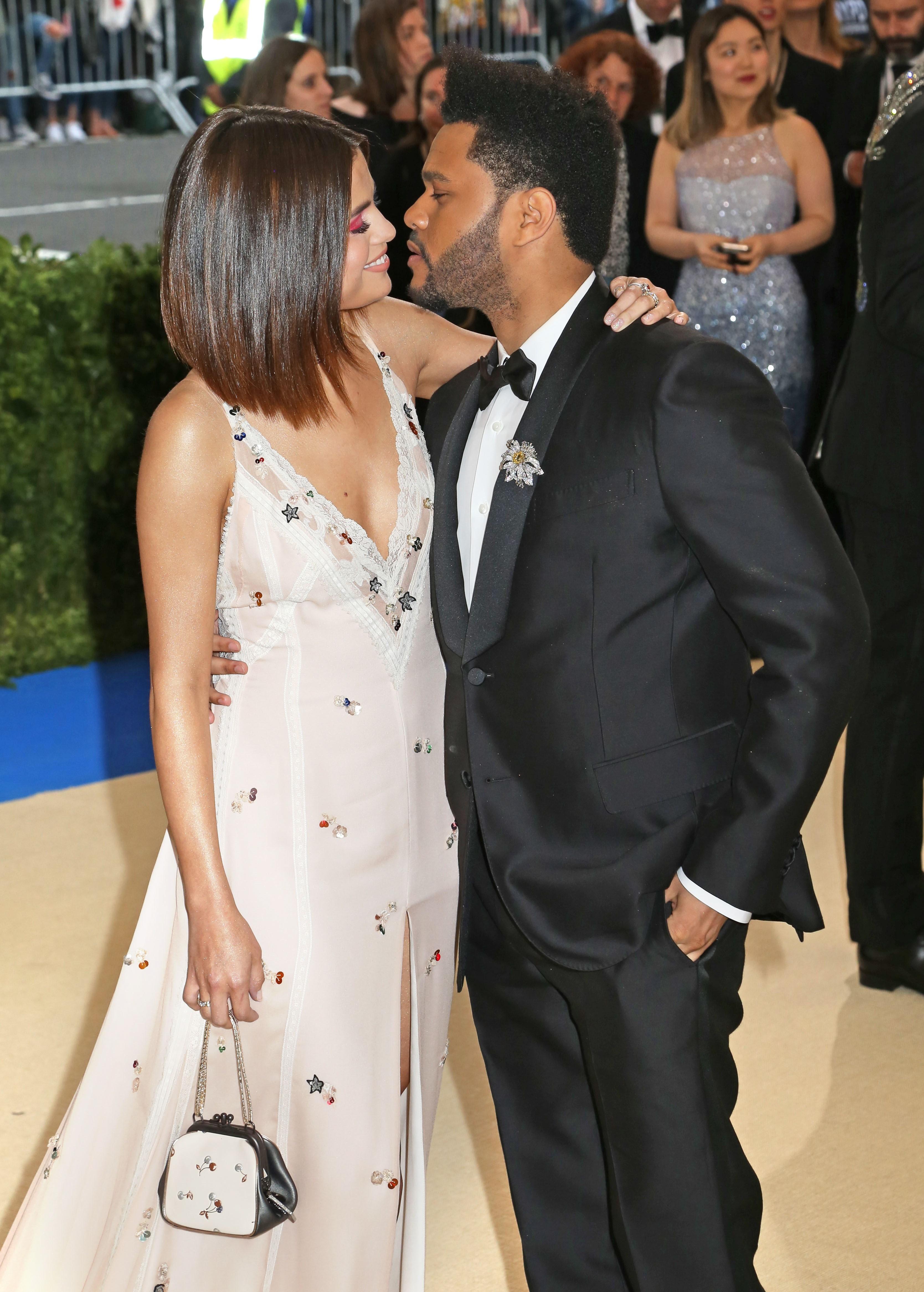 The Weeknd and Selena Gomez share the PDA at Met Gala