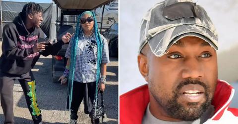 Photo of Chris Smoove with North West and a picture of Kanye West