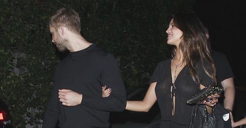 EXCLUSIVE: **PREMIUM EXCLUSIVE RATES APPLY** Calvin Harris is spotted in an arm in arm embrace with Eiza Gonzalez while leaving a party on Los Angeles.