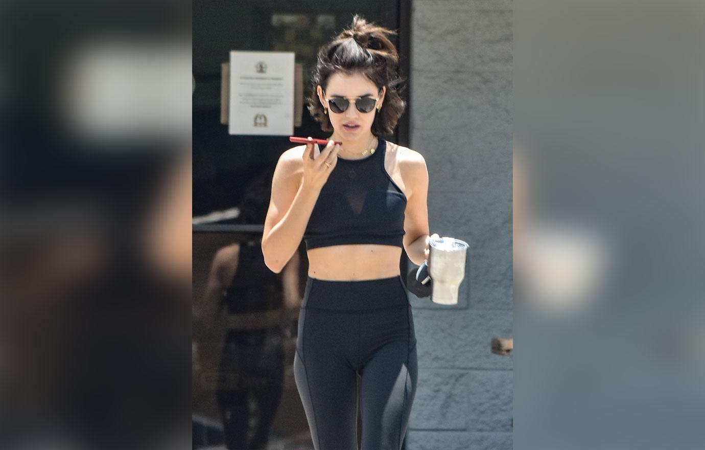 Lucy Hale sports a brown sports bra and leggings for a hot yoga