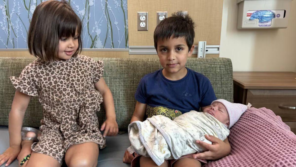 Image of Donald Trump shared a picture of two of J.D. Vance's kids holding their baby brother.