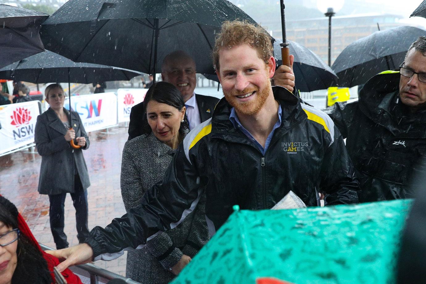 Prince Harry Australia Visit Rain Photos 03