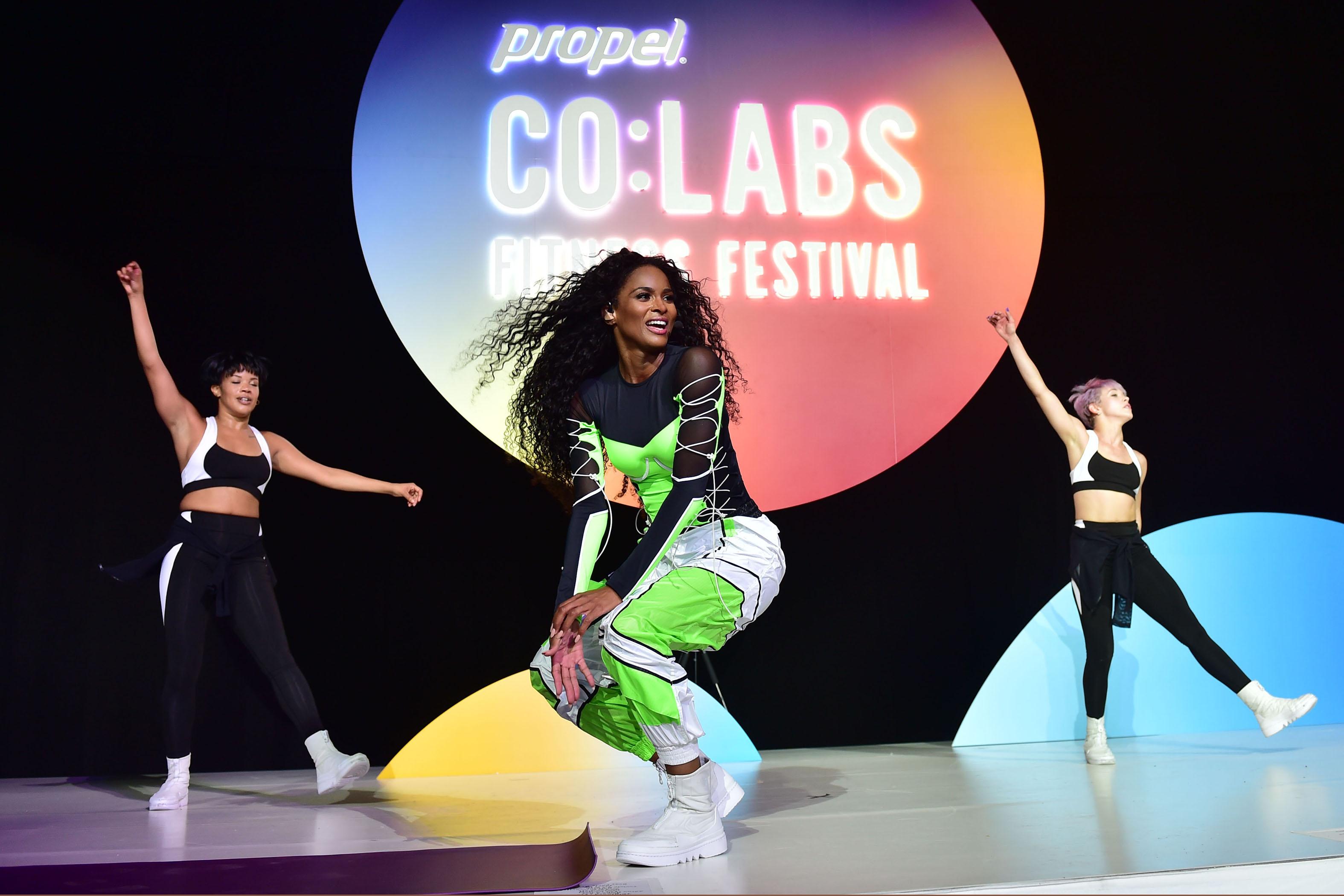 Ciara performs and co-leads a heart-pumping workout at the Propel Co:Labs Fitness Festival at Barker Hanger in Santa Monica with her personal trainer Decker Davis.