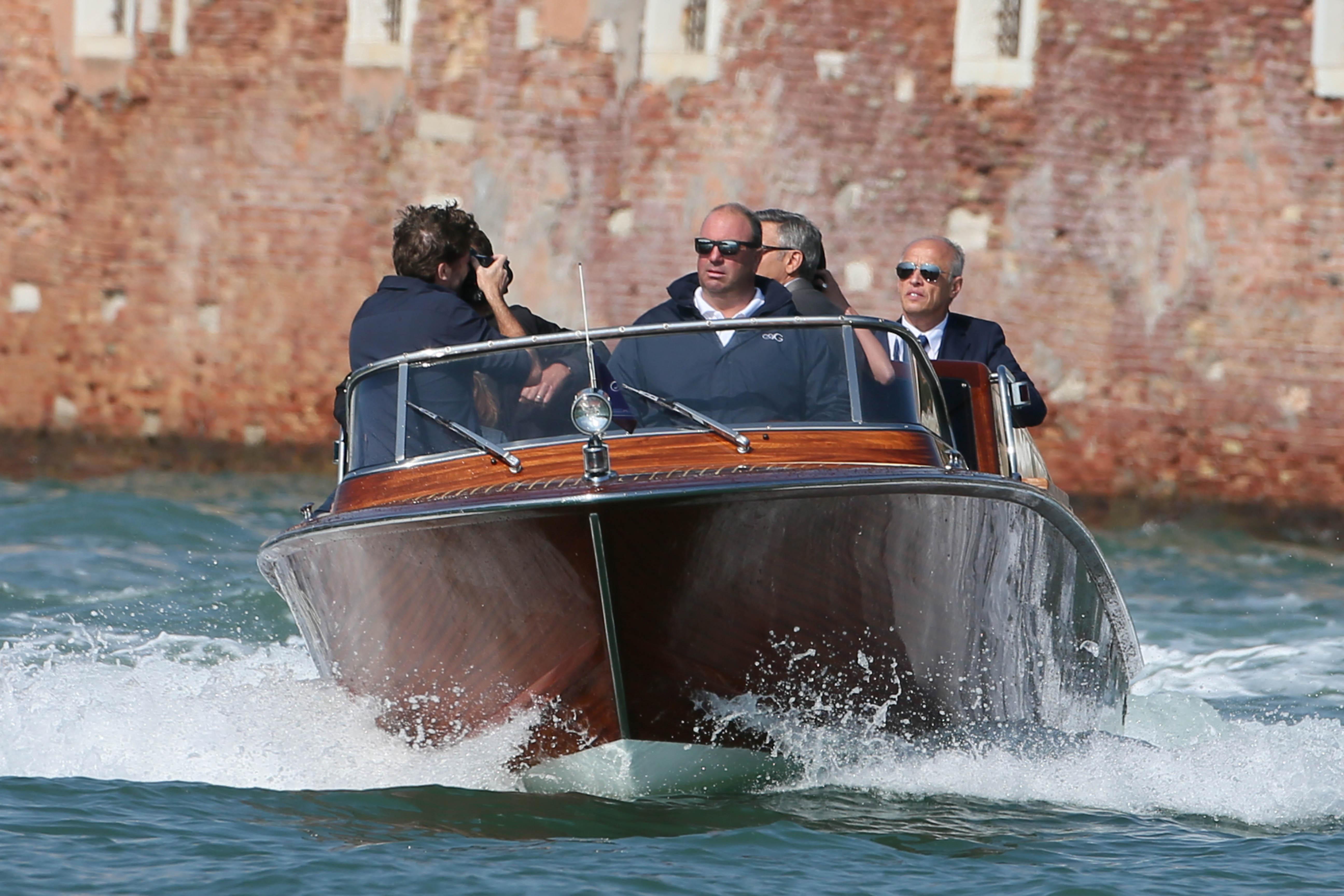 George Clooney and future wife Amal Alamuddin arrive by speedboat to their hotel in Venice