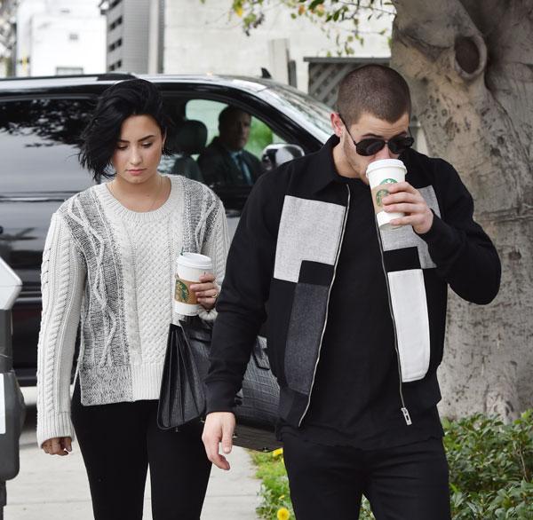 demi lovato nick jonas hugging while getting coffee