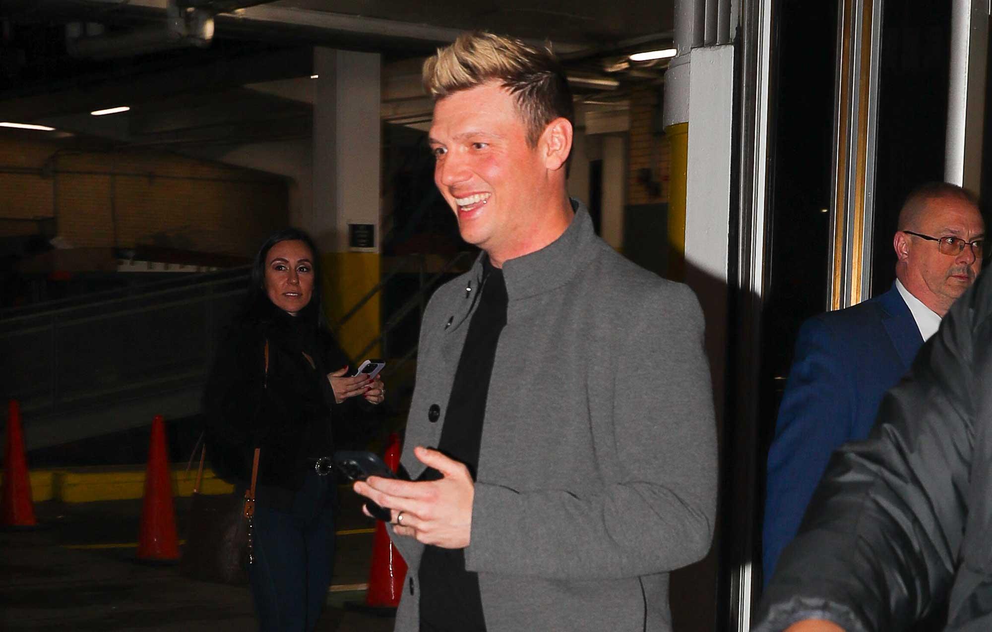 nick carter big smile denying sexual assault allegations