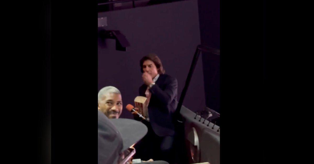 tom cruise cracks up reacts fans poking fun eats popcorn watch