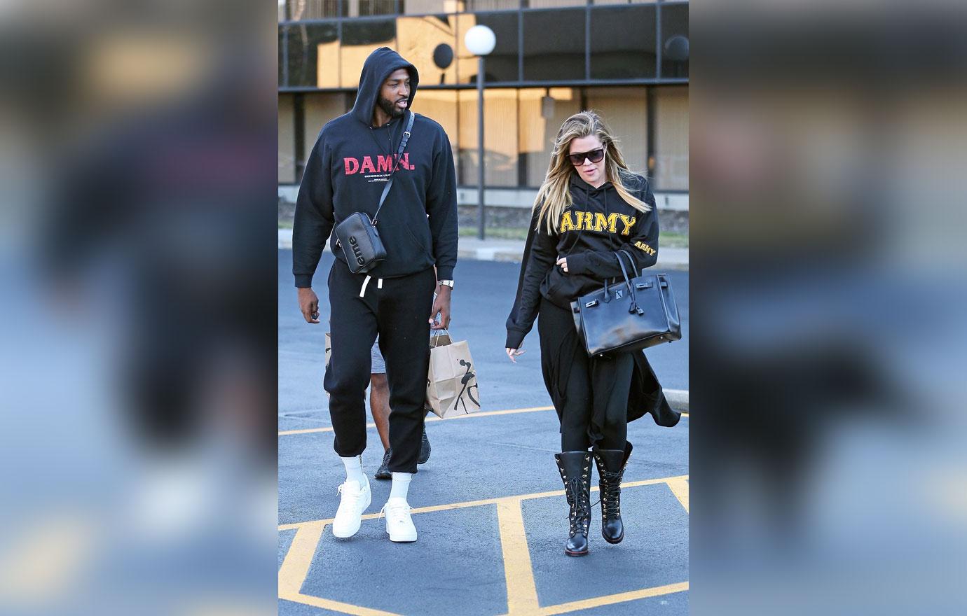 *PREMIUM EXCLUSIVE* Khloe Kardashian hides her growing baby bump in a baggy hoodie while out with Tristan Thompson