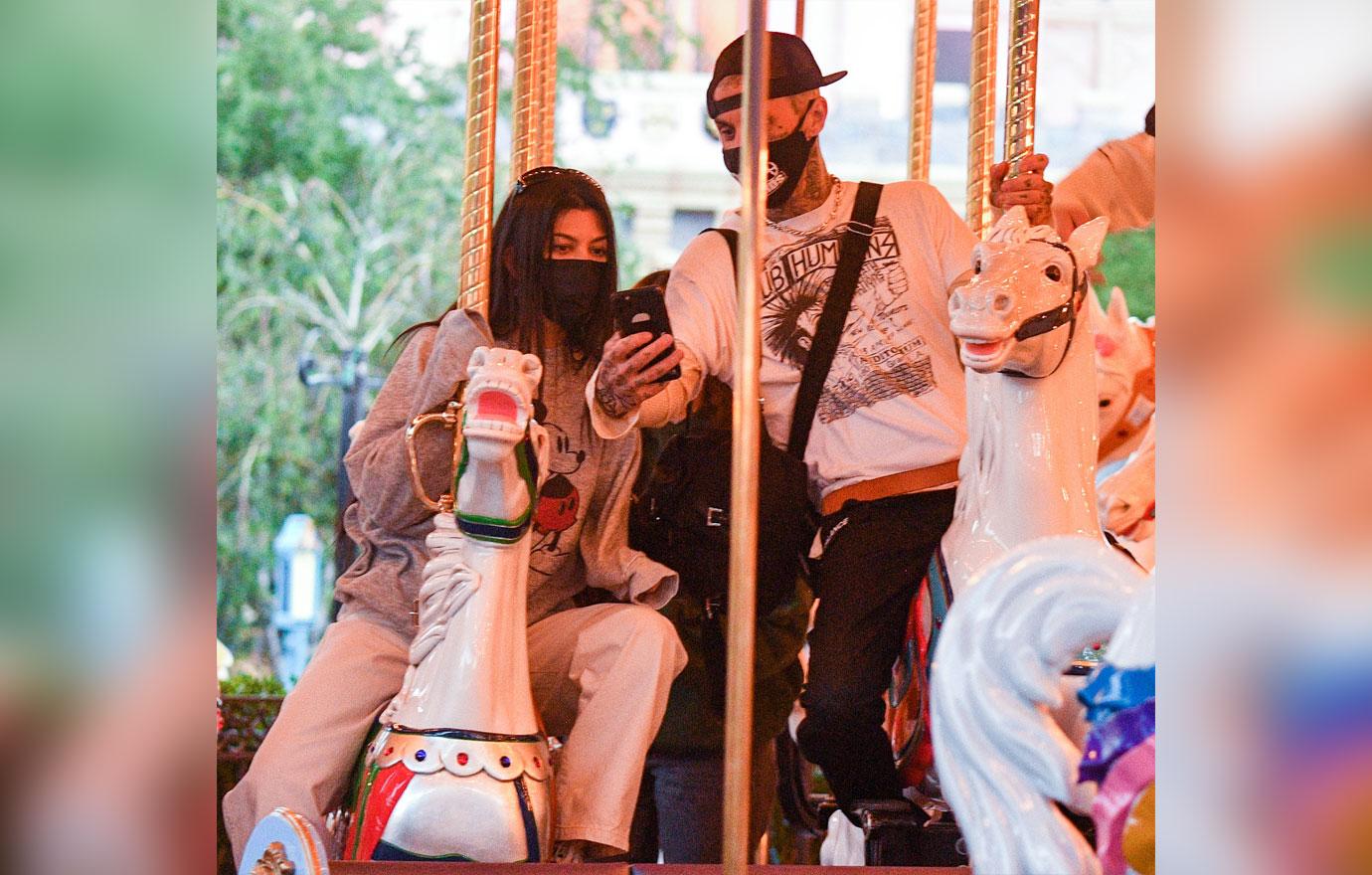 kourtney kardashian and travis barker take their modern family on a fun day out at disneyland