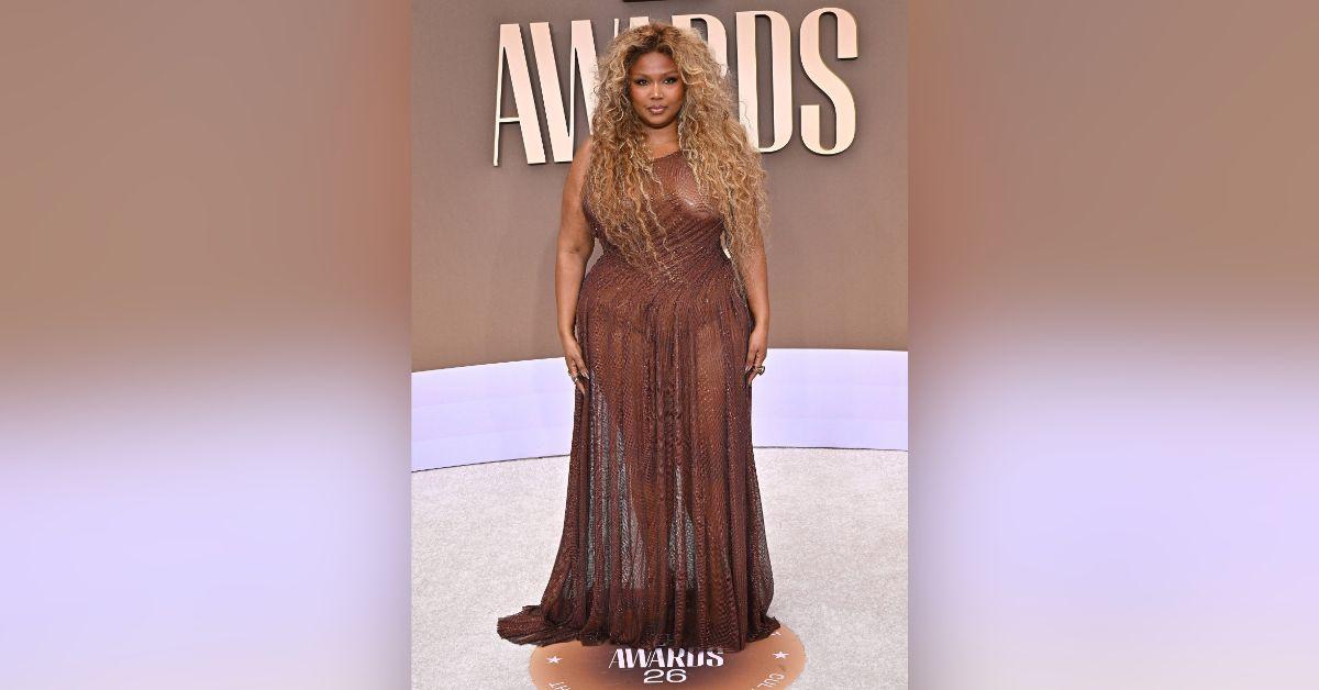 image of Lizzo stunned on the 2026 BET Awards red carpet in a sparkling, completely sheer brown gown.
